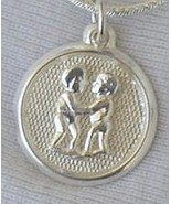 Gemini round pendant - $473.21 MXN