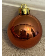 29 lot orange shiny plastic ball ornamants-gold tops-apprx 1 1/2” wide - $760.08 MXN