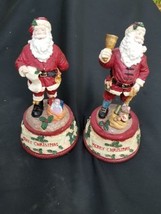 2 Santa Claus Figurines Music Box play We Wish You A Merry Christmas  - £28.81 GBP