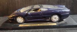 MAISTO  1992 JAGUAR XC220 1:18 SCALE DIECAST BLUE ON STAND - $11.65