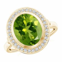 ANGARA Bezel-Set Oval Peridot Ring with Diamond Halo for Women in 14K Solid Gold - £2,134.65 GBP