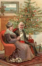 1905 German Embossed Christmas Postcard Victorian Couple At The Christmas Tree - £17.12 GBP