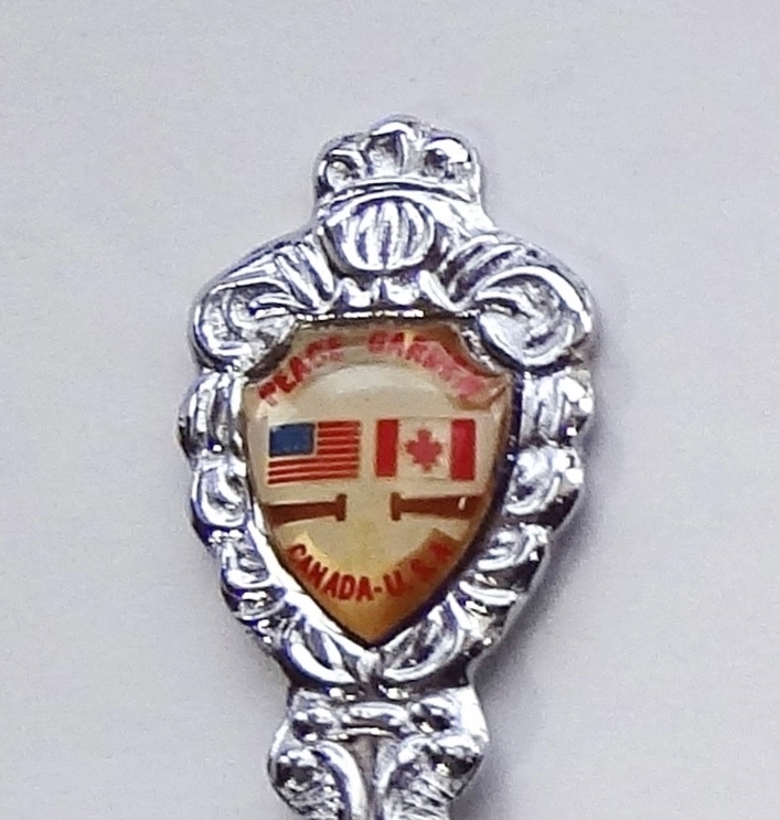 Collector Souvenir Spoon USA Canada Peace Garden Flags Emblem - $2.99