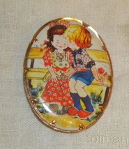 pinback brooch  boy and girl on bench kissing copper color backside UK register - £11.72 GBP