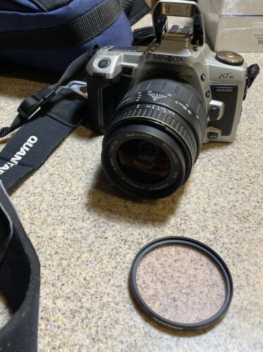 Minolta XT-Si, 35mm film lens w/Promaster 28-80mm AF zoom lens - $22.44