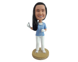 Custom Bobblehead Nice young dentist holding a pulling tool with a face ... - £69.98 GBP
