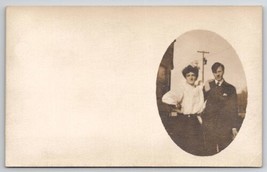 RPPC Couple Pose for Photo Woman Large Hair Bow Postcard J25 - $6.95
