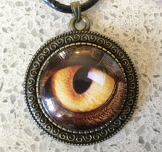 Golden Eye Pendant on Black Cord Necklace - £6.75 GBP
