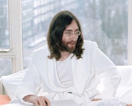 John Lennon classic 1970&#39;s in white robe sitting on bed 24x30 inch poster - $29.99