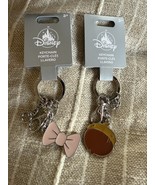 Disney Keychains Acorn and Pink Bow Lot of 2 Keychain Keyring Clip - $265.36 MXN