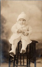 Rppc c1910 Baby in Knitted Outfit on Antique Craftman Style Stool Postcard U2 - £7.04 GBP