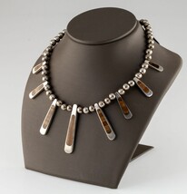 Authenticity Guarantee

Mexico Sterling Silver Tiger Eye Bib Bead Neckla... - $588.06