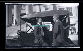 black and white negative -2 man talking next to car lady in back seat - $8.95