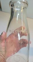ONE PINT MILK BOTTLE EMBOSSED WITH 7 MINN SEALED 52 LC image 4