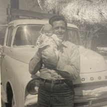 Found B&amp;W Photo Man Holding Baby In Front Of Car Snapshot 1970s - £7.86 GBP