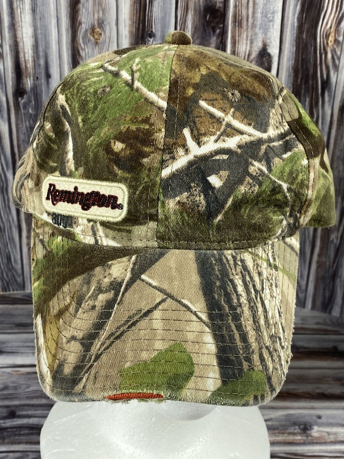 Primary image for Remington Distressed Green APG Camo Adjustable Strap Back Trucker Hat (C) - Read