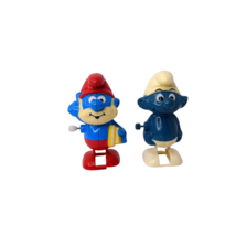 Lot of 2 Vintage Smurf Wind-Up Toys 1980 Smurf &amp; 1982 Papa Smurf - $320.19 MXN