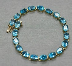 9Ct Oval Cut Blue Topaz Lab-Created Tennis Bracelet In 14K Yellow Gold Plated - £269.15 GBP