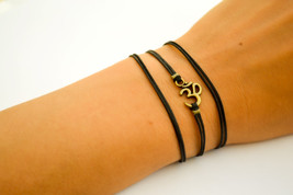 OM bracelet, wrapped bracelet with bronze tone Om charm, Hindu symbol, black, gi - £10.22 GBP