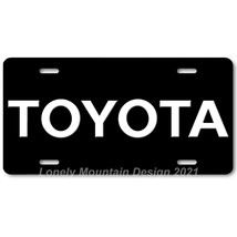 Toyota Text Inspired Art White on Black FLAT Aluminum Novelty License Ta... - £14.14 GBP