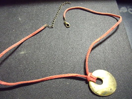 Metal Oval Disk with orange leather cord necklace - €15,38 EUR