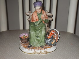 Vintage Lefton Woman Sitting On Bench With A Turkey Porcelain Figurine - £35.87 GBP