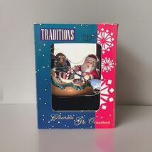 NEW Ornament Traditions Santa Paddling Canoe with gifts - $6.93