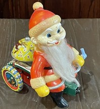 Vtg Christmas Wind Up toy Santa Fuzzy Beard on Tricycle W/Bell Made In J... - $16.68