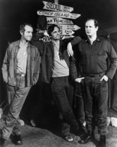 M.a.s.h Alan Alda Mike Farrell David Ogden-Stiers next to sign post 16x20 Canvas - $69.99