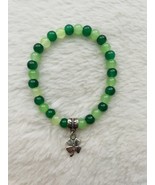 Dark green and light green glass bead bracelet with 4 leaf clover charm. - $7.00