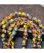 Brown tint small yellow smiley faces Venetian inspired Beads Strand - $874.50 MXN