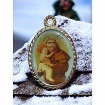 Beautiful vintage pendant of a saint holding baby Jesus - $14.85