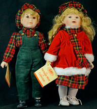 Pair of Heritage Mint Porcelain Dolls Boy &amp; Girl All Decked out for Christmas - £25.54 GBP