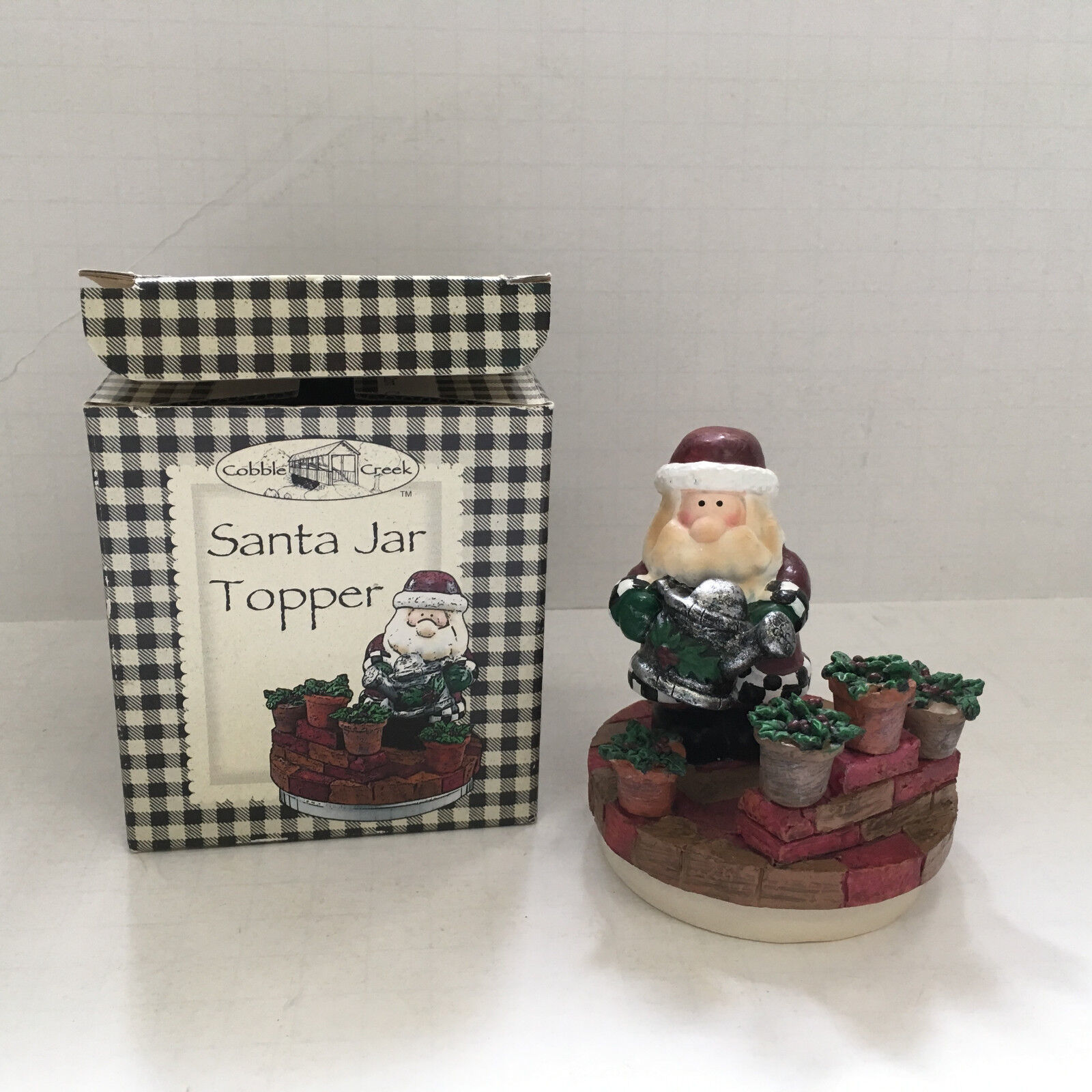 Primary image for Santa Jar topper decorative top for candle jar Santa watering poinsetta plants