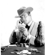 Roger Moore holds up cards as Beau Maverick at gaming table 12x18 inch p... - $373.69 MXN