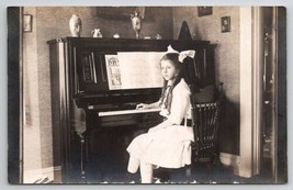 RPPC Lovely Edwardian Girl Big Hair Bow At Piano c1910 Real Photo Postcard H36 - $15.95