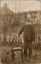 RPPC Man News Boy Cap in Garden with Chair Real Photo c1907 Postcard U16 - £3.10 GBP