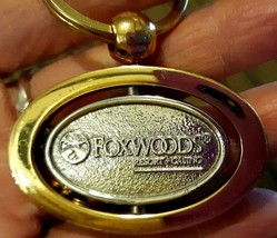 Foxwoods Resorts Casino Keychain Goldtone Silvertone Gambling Gambler Oval - $15.47