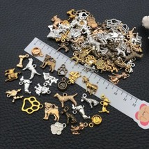 10 Dog Charms Assorted Pendqnts Lot Paw Print Antiqued Silver Gold Bronz... - $8.42