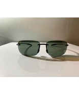 Men&#39;s minimalistic sunglasses with black wire frame and green tinted lenses - $10.00