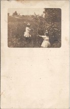 RPPC Girls Picking Flowers in Field Gertrude and Ruth Asgood c1900s Postcard V15 - £6.35 GBP