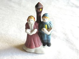 Christmas Village Figurine Boy Girl Singing Caroler Lampost Children Kid... - $9.49