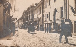 Vintage RPPC Postcard Lviv Ukraine Street Scene Horse Cart Shops Flags c... - $19.80