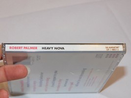 Heavy Nova by Robert Palmer CD 1998 Capitol Records Between Us Casting a Spell - £10.44 GBP