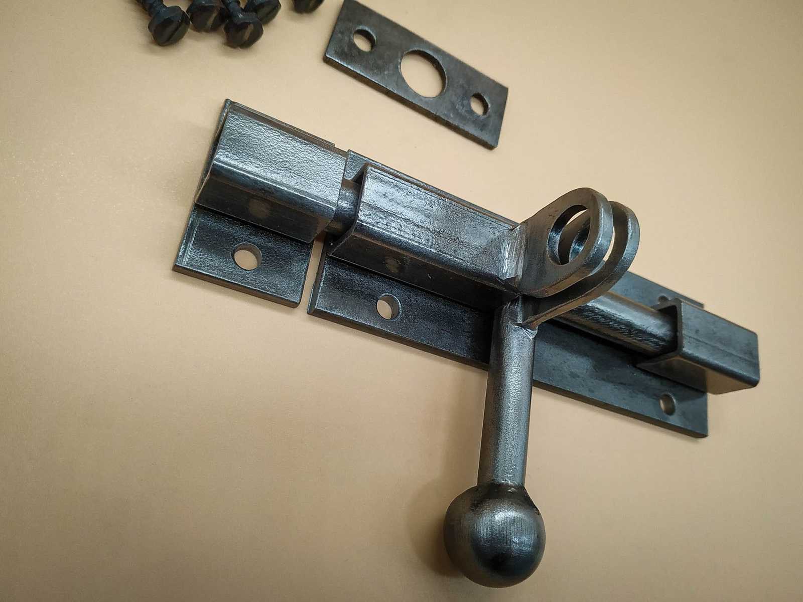 An industrial door latch, handcrafted from steel in a rustic style, ensu... - $36.80