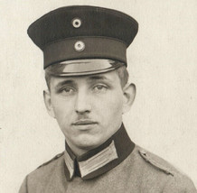 WWI German Soldier In Uniform Cap Cockade Portrait Real Photo Postcard - £8.42 GBP