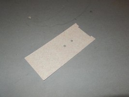 LIONEL PART -601-60- BATTERY BRACKET INSULATION -  NEW - H46E - $1.32