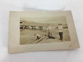 Kids Playing in Sand Mud on Beach with Dog Near Dock Early 1900&#39;s Postcard - £26.57 GBP