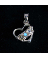 Heart shaped Sterling silver Gemstone Pendant with 4 small Sparkling Blu... - $54.33 CAD