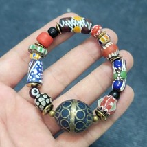Vintage african venetian style glass with afghani big brass beads bracelet - $490.45 MXN